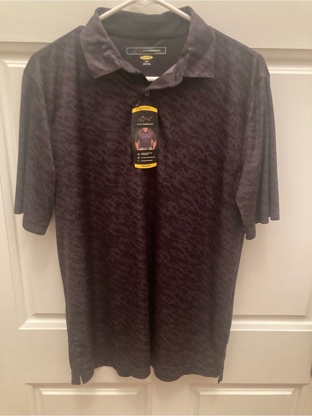 Greg Norman Collection Men's Black Polo. All over Shark Patterned